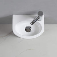 1 x RAW Customer Returns Oval wall mounted ceramic washbasin for cloakroom and bathroom right hand  - RRP €61.9