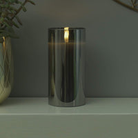 20 x Brand New Festive Lights 15cm real wax LED candle in a smoked glass cylinder - Authentic flickering flame on a realistic black wick - Battery operated with timer - RRP €300.0