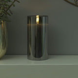 12 x Brand New Festive Lights 15cm real wax LED candle in a smoked glass cylinder - Authentic flickering flame on a realistic black wick - Battery operated with timer - RRP €114.0