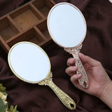 1 x RAW Customer Returns minkissy Vintage Hand Mirror Oval Shape Glass Mirror Portable Cosmetic Mirror with Handle for Women Rose Gold  - RRP €9.67