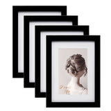 1 x RAW Customer Returns Egofine picture frame 15x20cm black set of 4, robust wooden composite photo frames with real glass for pictures 10x15cm with mat - horizontal or vertical for wall hangings or table decoration - RRP €24.19