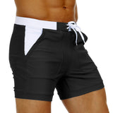 1 x RAW Customer Returns KEFITEVD Men s Swimming Shorts Figure-hugging Slim Fit Beach Pants with Pockets Surf Shorts Board Quick Dry Stretch Waistband Shorts Bathing Surfer Leisure Pants Black 38 - RRP €26.2