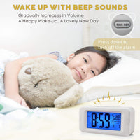 1 x RAW Customer Returns Plumeet Electronic Alarm Clock with Sensor Light, Glows All Night, 4-inch LCD Screen with Time, Alarm Time, Date, Bedside Alarm Clock with Snooze Suitable, Battery Operated White  - RRP €14.51