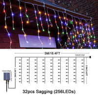 1 x RAW Customer Returns JIMACRO Solar Outdoor String Lights, 32pcsx0.8M 256 LED Curtain Fairy Lights, 7M Waterproof Solar Decoration Lights Garland, 8 LED Modes Solar Fairy Curtain Lights Christmas Outdoor - RRP €26.77