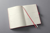 1 x RAW Customer Returns SIGEL C2570 Weekly Planner 2025, approx. A5, red, hardcover, 192 pages, elastic band, pen loop, archive pocket, made of sustainable paper, Conceptum - RRP €25.04