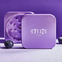 1 x RAW Customer Returns STEEZY Classic Grinder Medical Herb Grinder square CNC machined aircraft aluminum alloy sharp monolith grinder Plug rail system 63mm square 2-part Purple Rose  - RRP €39.89